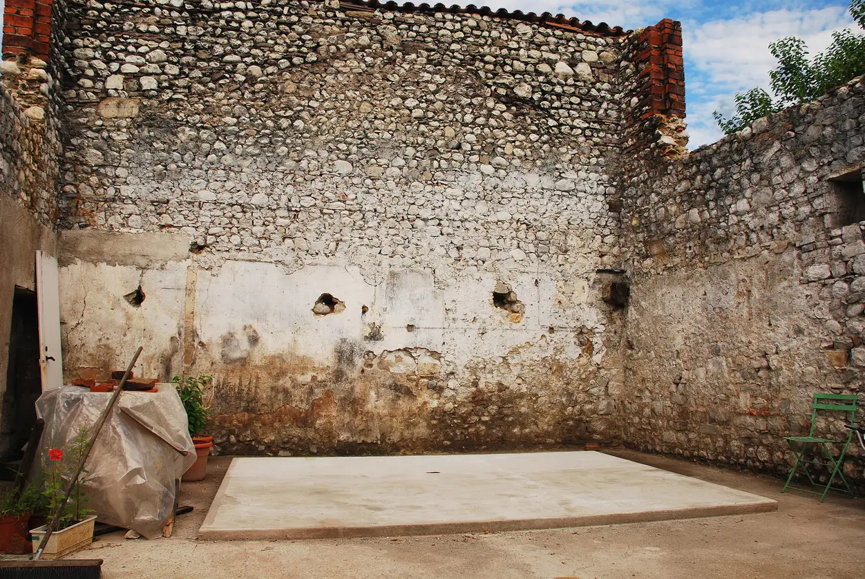 Freshly installed concrete shed base in a Slough garden