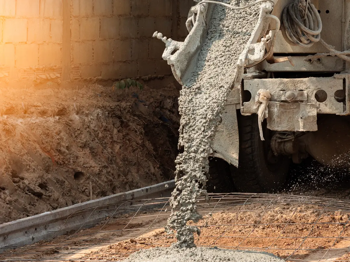 Concrete being poured for a shed base